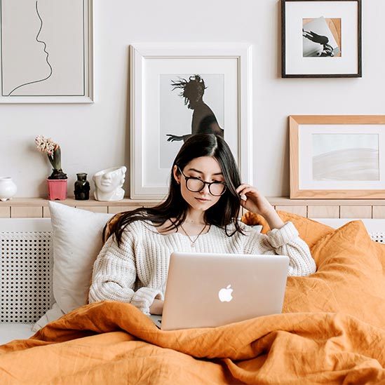 Woman Working in Bed Woman Working in Bed